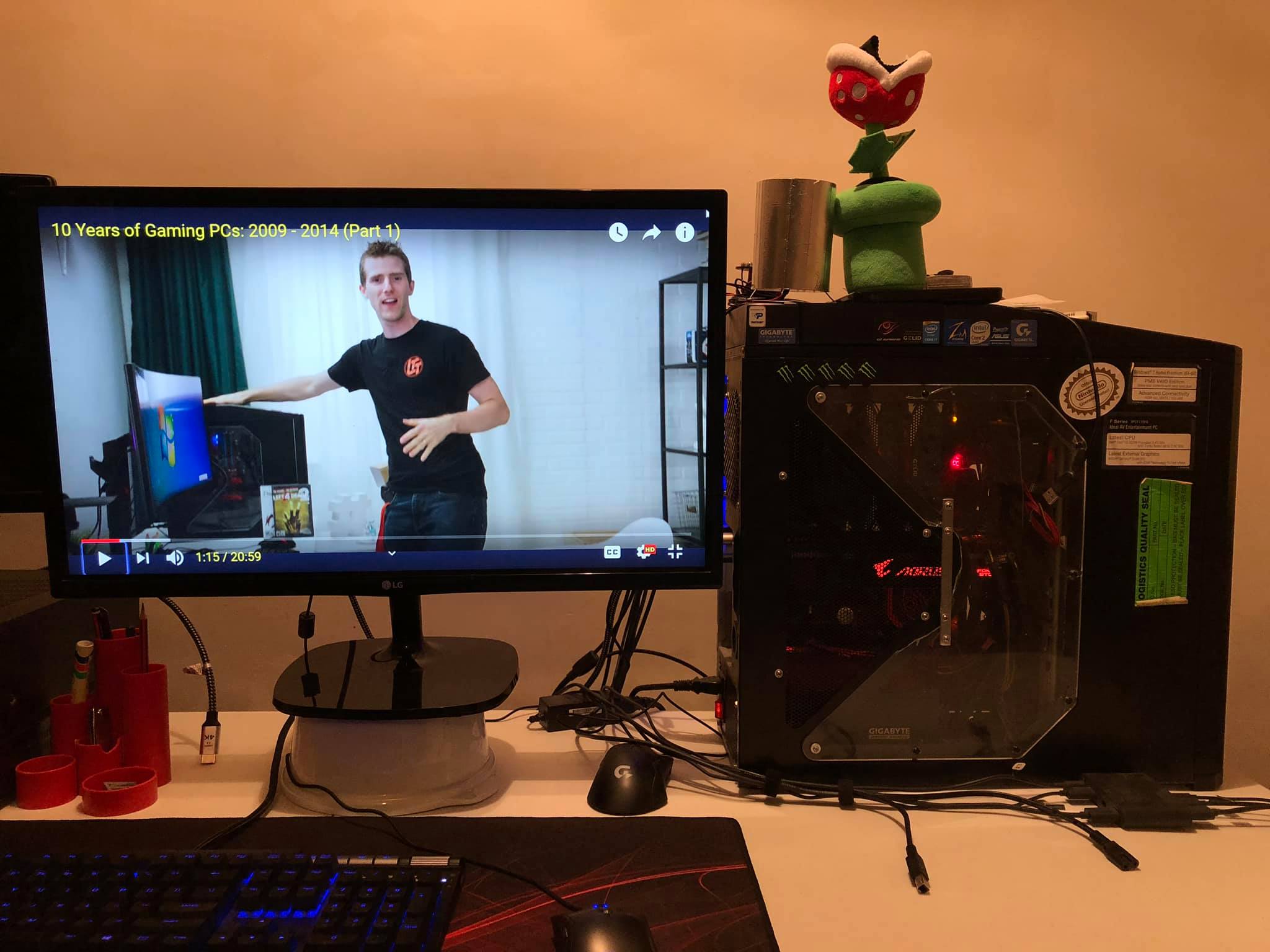 Linus from LinusTechTips showing off an Antec 900 PC Case (a remarkably good PC Case of the era) on the Computer Monitor, next to my own Antec 900