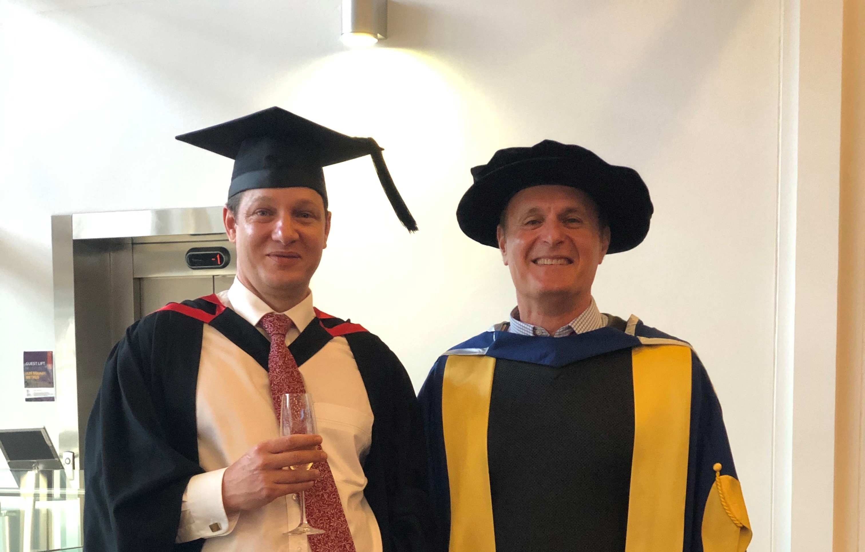 Justin Bentley graduating at University of Canberra, with
            Dr. Masoud Mohammadian